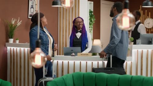 Receptionist Welcoming Guests at Hotel