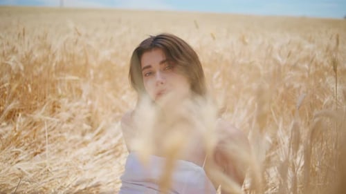 Contemplative Girl Sitting Field Alone Close Up Romantic Woman Looking Camera