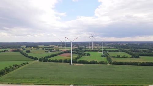 Wind turbines next to highway