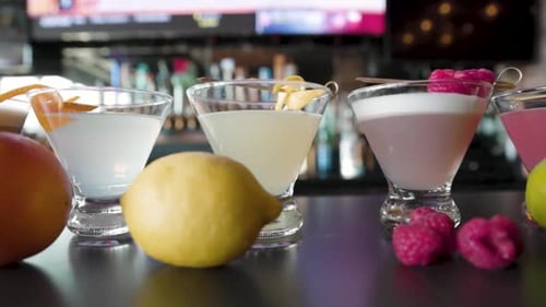 Refreshing Cocktails Arranged on Bar with Fruit and Liquor