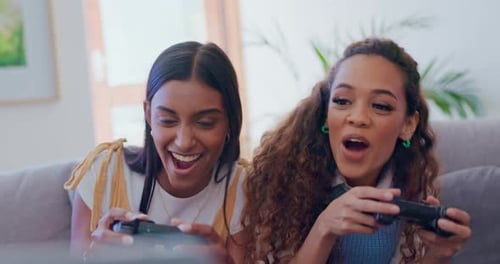 Two Young Women Playing Video Games Together