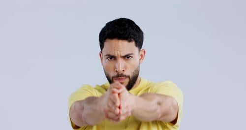 Man, studio and pointing finger gun for target practice, shooting and hand gesture