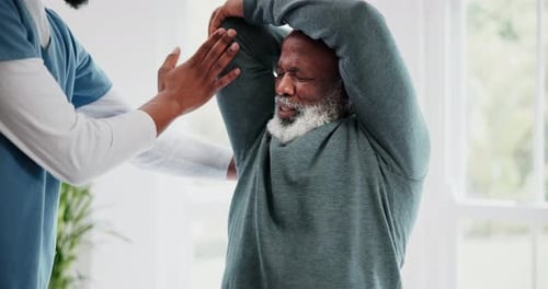 Senior Man Exercising with Physical Therapist