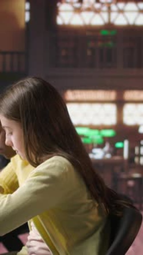 Students Studying at Desk in School