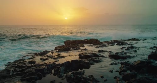 Sea Waves at Orange Sunset Sky and Sun Background