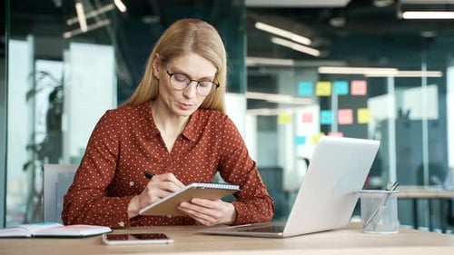 Woman Leads Video Call in Modern Office