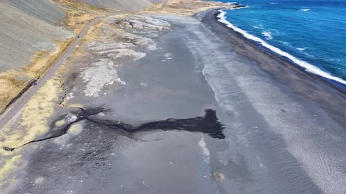 Aerial view of coastal landscape with clear water, Iceland.