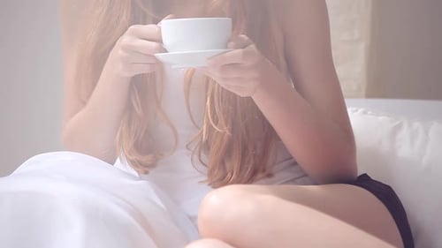 Woman Enjoying Morning Coffee at Home