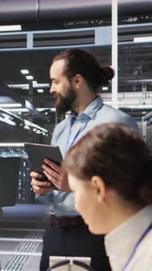 Man and Woman Work in Modern Tech Office