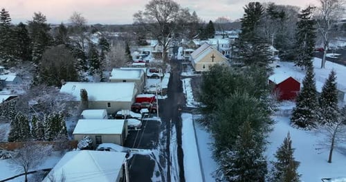 Christian Church in small town in USA. Fresh snow covers trees in winter snowy scene.