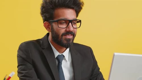 Closeup Businessman Freelancer at Office Workplace Working on Laptop Computer Sends Online Messages