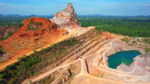 Aerial view from a drone flying over a quarry in the tropics