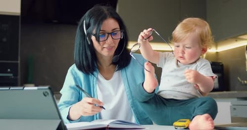 Mother Working from Home with Baby