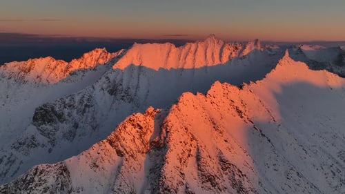 Aerial view of Snowy Mountain Peaks, Norway.
