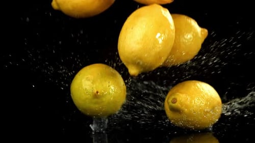 Lemons Fall on a Wet Surface Filmed on a Highspeed Camera at 1000 Fps