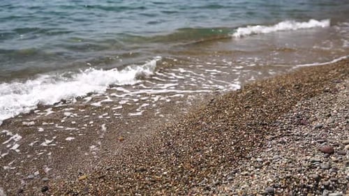 Small Sea Wave Blurred Soft Foamy Waves Washing Golden Sandy Beach on Sunset