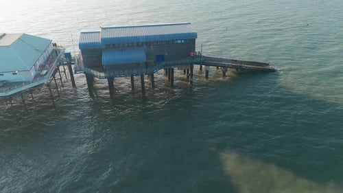 Aerial view of Cromer Pier lifeboat station extending over the sea in Norfolk, UK