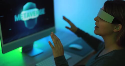 Woman Using Metaverse Technology at her Desk