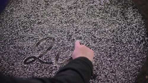 Hand Writing 2023 in Powdered Snow for New Year