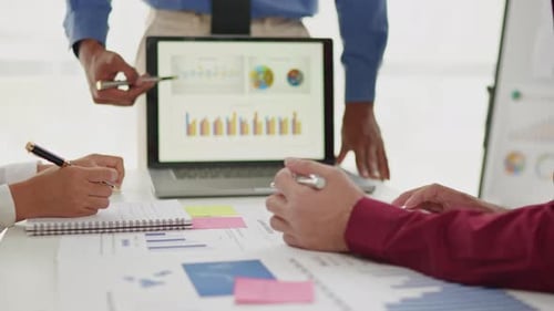 Close up of business hands are working and brainstorming on paperworks.