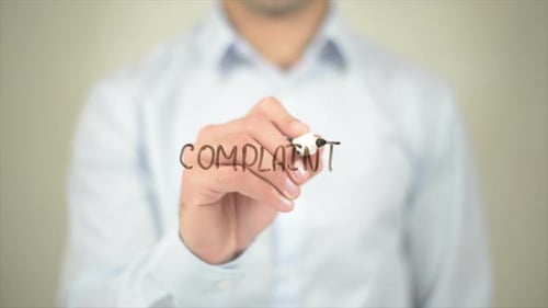 Complaint, Man Writing on Transparent Screen