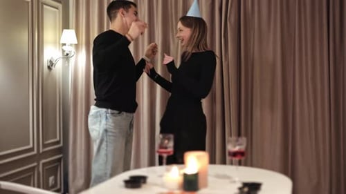 Young Couple Dancing at a Birthday Celebration