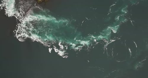 Tourist boat approaches strong tidal current at Saltstraumen, Norway. Aerial
