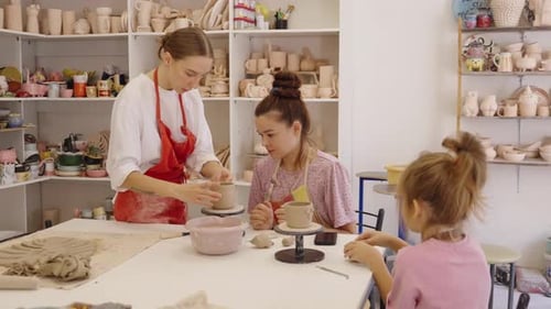 Creative Pottery Workshop in a Cozy Studio with Children Crafting
