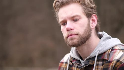 Man Close Up Looking Thoughtful Outside