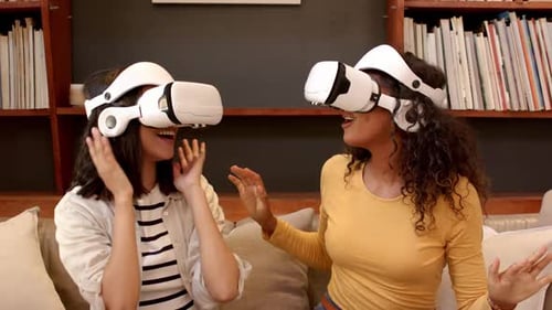 Young Women Experiencing Virtual Reality with VR Headsets