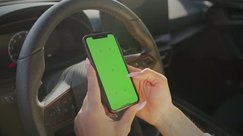 Woman Holding Cellphone with Chroma Key Screen