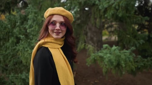 Young Woman in Beret and Scarf in Autumn Park