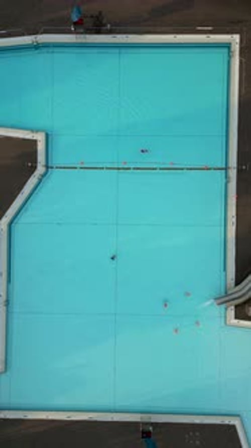 Aerial view of vibrant public pool with slide, Germany.