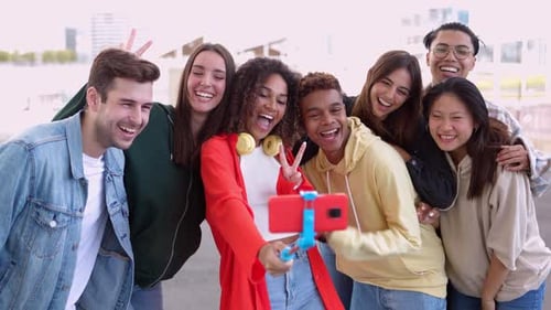 Smiling Friends Taking Selfie in City