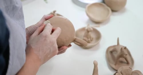 Woman Forming Clay Cup Shape By Hands Closeup in Artistic Studio