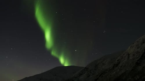 Stunning timelapse footage of the northern lights dancing across the night sky in Norway. Vivid gree