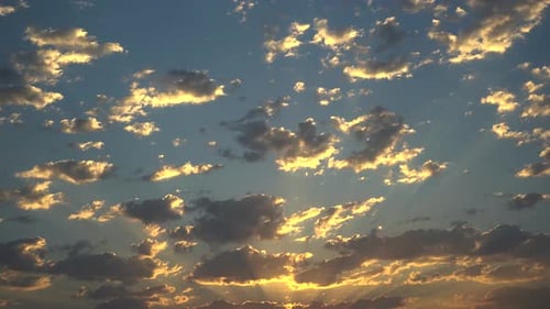 Golden Sunset with Clouds and Sunlight Rays