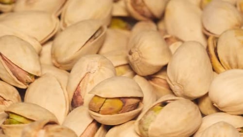 Rotating Close-Up of Fresh Pistachios in Shells
