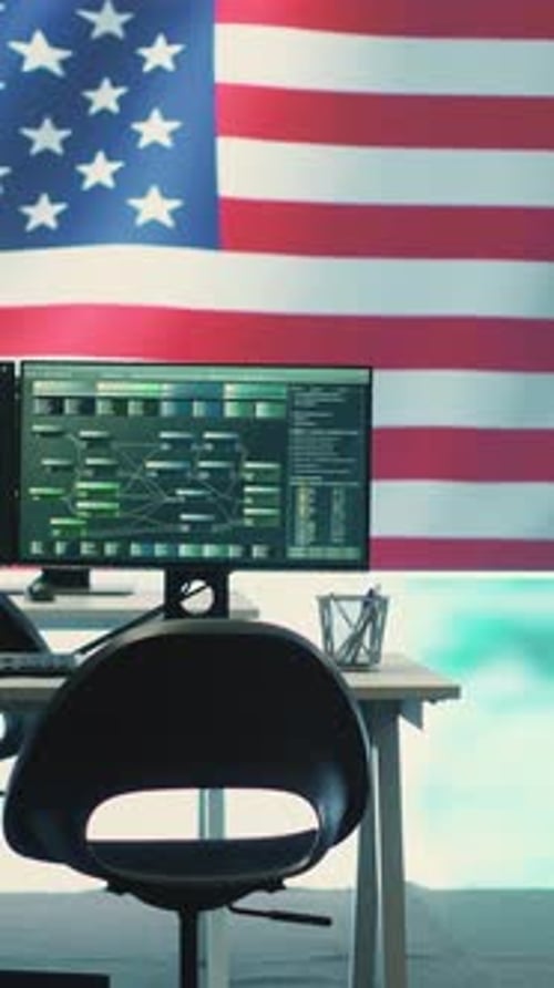 Computer Monitors with American Flag in Office