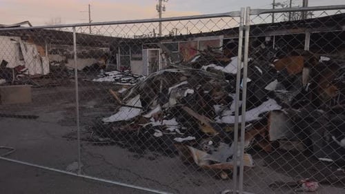 Burnt store ruins, left to right pan