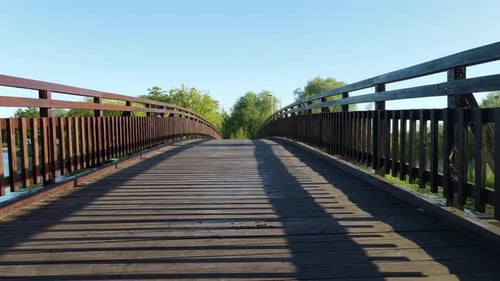 Walk on the wooden bridge over the river