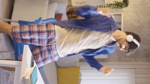 Energetic Young Man Dancing at Home