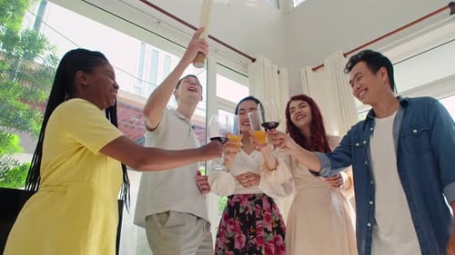 Friends Toasting with Confetti at Birthday Party