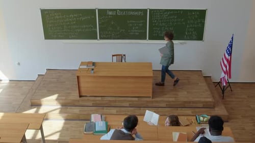 Professor Lecturing to Students in College Classroom