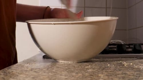 Whisk Mixing Batter in White Bowl on Counter