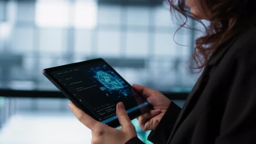 Engineer in Data Center with Tablet Integrating AI Driven Automation Tools