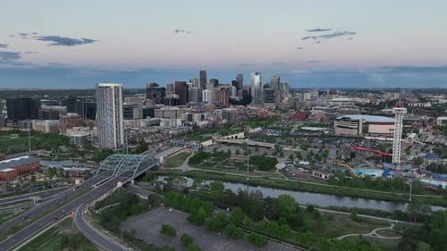 Sunset aerial view of Denver city skyline over South Platte River and Auraria