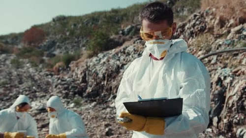 Scientists in Protective Suits at Landfill