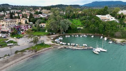 Aerial View of Scenic Circular Boat Harbor Filled with Small White Vessels in Gouvia, Corfu, Greece