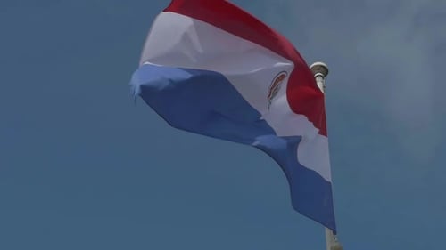 Flag of Paraguay Waving Against Blue Sky